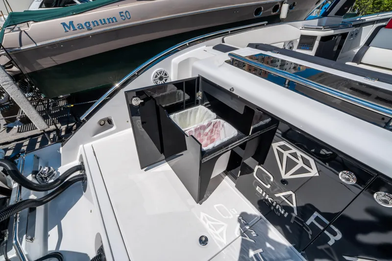 Slide: The Image of 2021 Cigarette 59 Tirranna yacht with open storage compartment, showcasing luxury design features. - 19