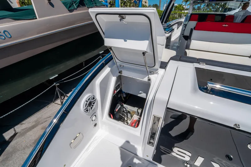 Slide: The Image of 2021 Cigarette 59 Tirranna boat storage compartment open, showcasing interior details. - 20