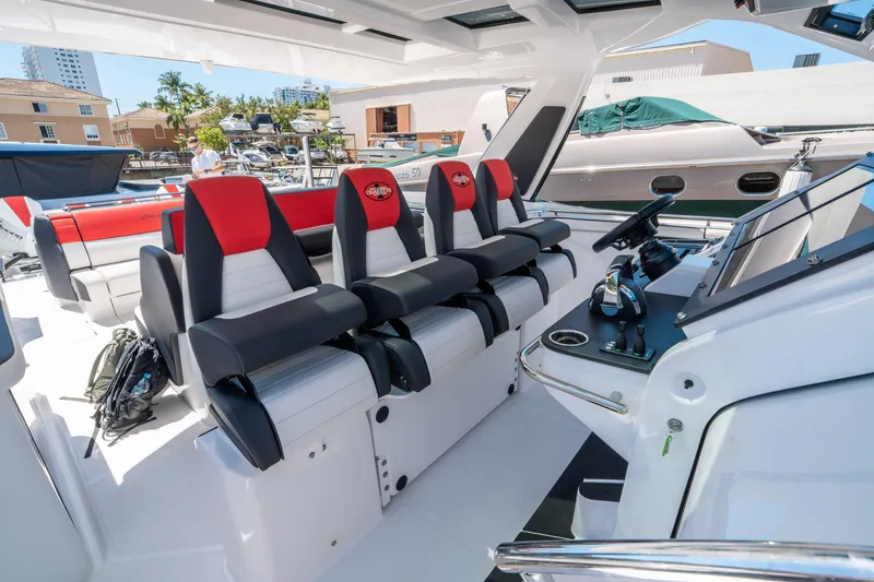 Slide: The Image of 2021 Cigarette 59 Tirranna boat interior with sleek seating and modern dashboard. - 27