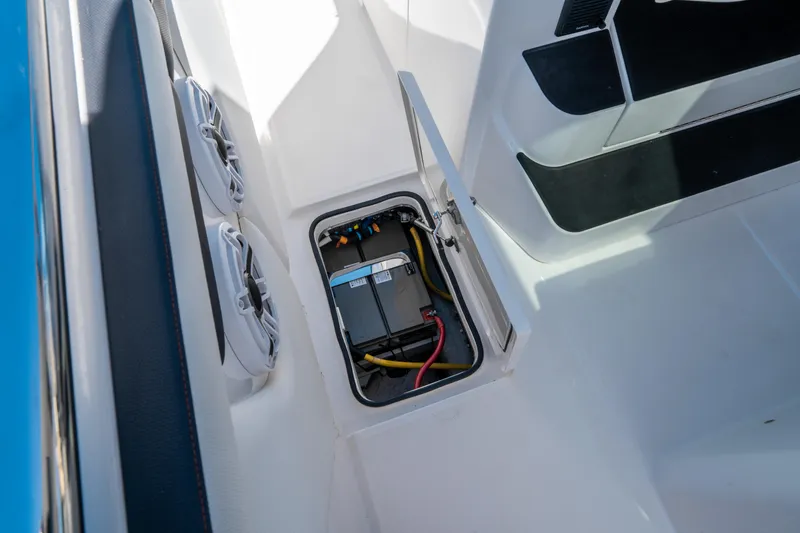 Slide: The Image of Battery compartment of 2021 Cigarette 59 Tirranna boat, featuring wiring and secure hatch. - 30