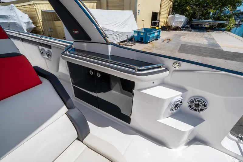 Slide: The Image of 2021 Cigarette 59 Tirranna boat interior with sleek seating and modern storage compartments. - 34