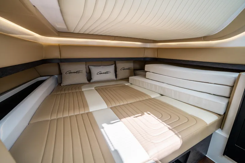 Slide: The Image of Luxurious interior cabin of 2021 Cigarette 59 Tirranna with beige seating and branded cushions. - 40