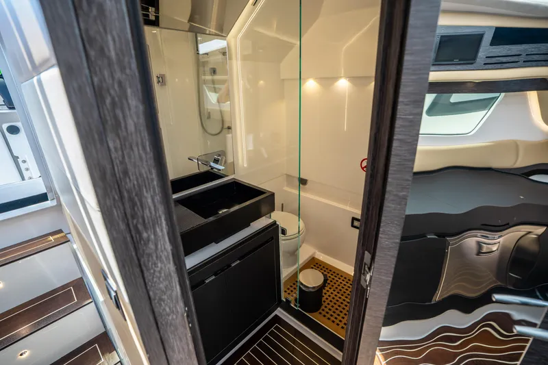 Slide: The Image of Luxurious bathroom interior of 2021 Cigarette 59 Tirranna yacht, featuring modern fixtures and elegant design. - 43