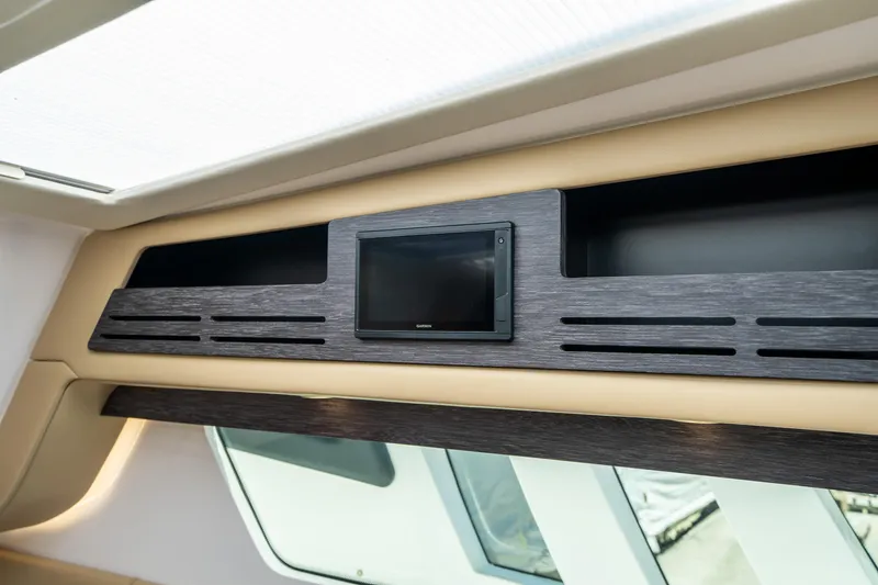 Slide: The Image of Interior of 2021 Cigarette 59 Tirranna, featuring sleek wood paneling and a built-in screen. - 44