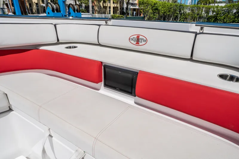 Slide: The Image of 2021 Cigarette 59 Tirranna boat interior with red and white seating, cup holders, and logo. - 48
