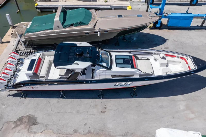 Slide: The Image of 2021 Cigarette 59 Tirranna boat on dry dock, aerial view, sleek design, luxury features. - 6