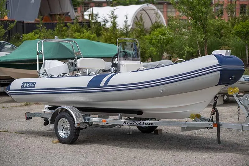 Slide: The Image of 2024 Coastal Inflatable Boat GTS17 on trailer, parked outdoors. - 3
