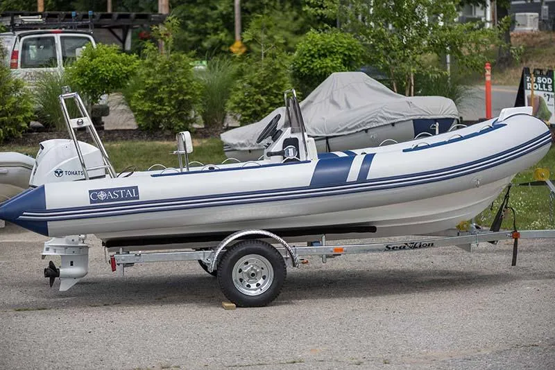 Slide: The Image of 2024 Coastal Inflatable Boat GTS17 on trailer, parked outdoors. - 4
