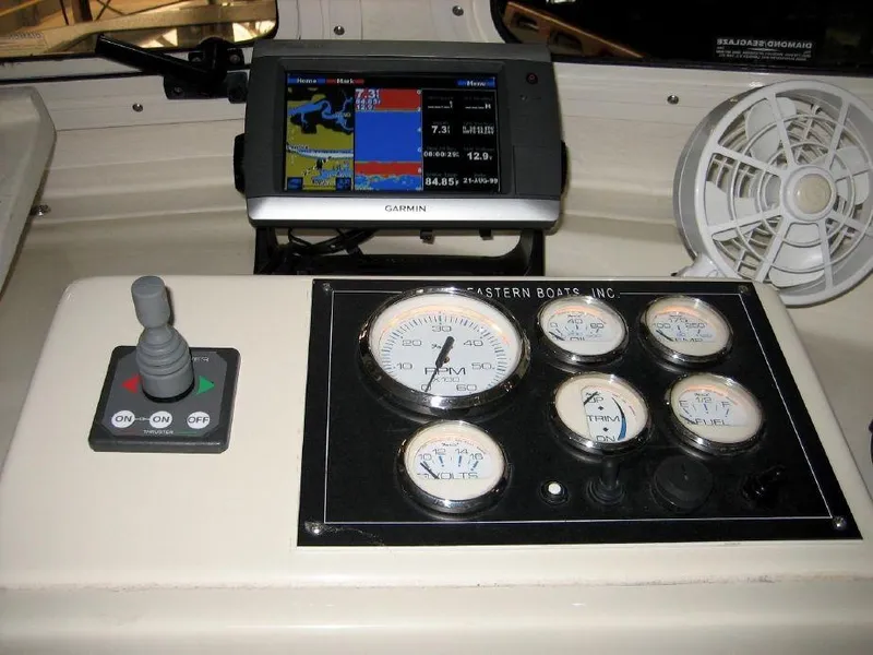 Slide: The Image of Control panel of a 2008 Eastern 27 boat with gauges and Garmin GPS. - 4