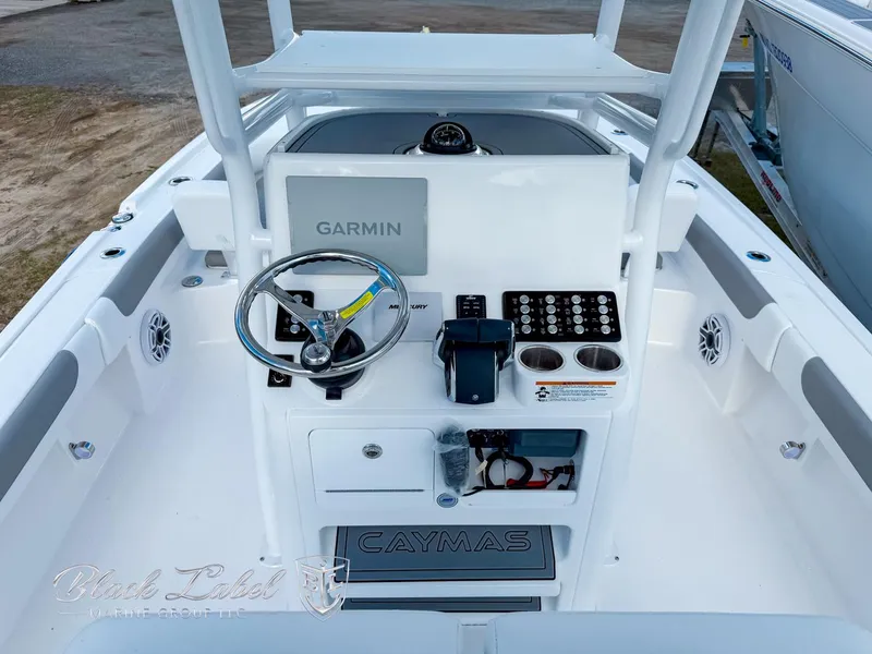 Slide: The Image of 2025 Caymas 281 HB boat console with Garmin system and steering wheel. - 17