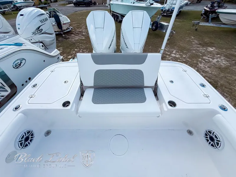 Slide: The Image of 2025 Caymas 281 HB boat with dual engines and spacious seating area. - 25