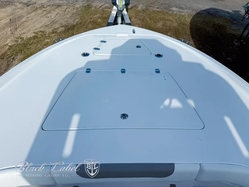 Slide: The Image of 2025 Caymas 281 HB boat deck with storage compartments, viewed from above. - 7