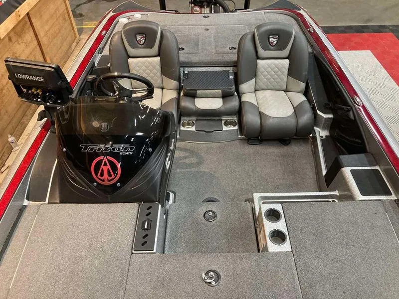 Slide: The Image of 2017 Triton 21 TrX boat interior with dual seats and Lowrance electronics. - 9