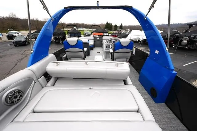 Slide: The Image of 2019 South Bay 523SB2 pontoon boat with blue accents and spacious seating. - 11