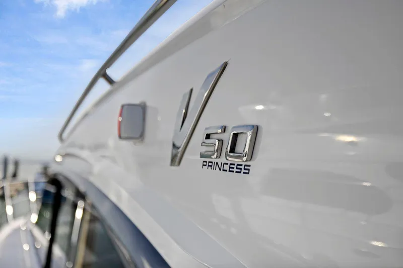 Slide: The Image of 2019 Princess V50 yacht exterior with logo detail. - 12