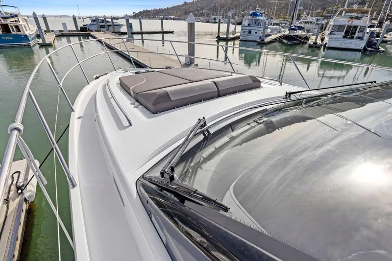 Slide: The Image of 2019 Princess V50 yacht docked at marina, showcasing sleek design and spacious deck. - 14