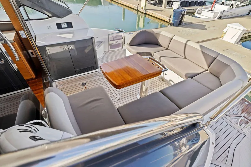 Slide: The Image of Luxurious 2019 Princess V50 yacht interior with elegant seating and wooden table. - 19