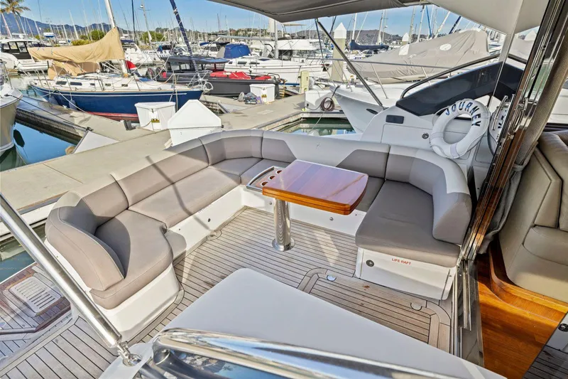 Slide: The Image of Luxurious 2019 Princess V50 yacht with spacious seating and elegant design in marina setting. - 20