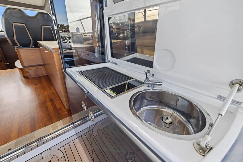 Slide: The Image of 2019 Princess V50 yacht interior with sink and seating area. - 22