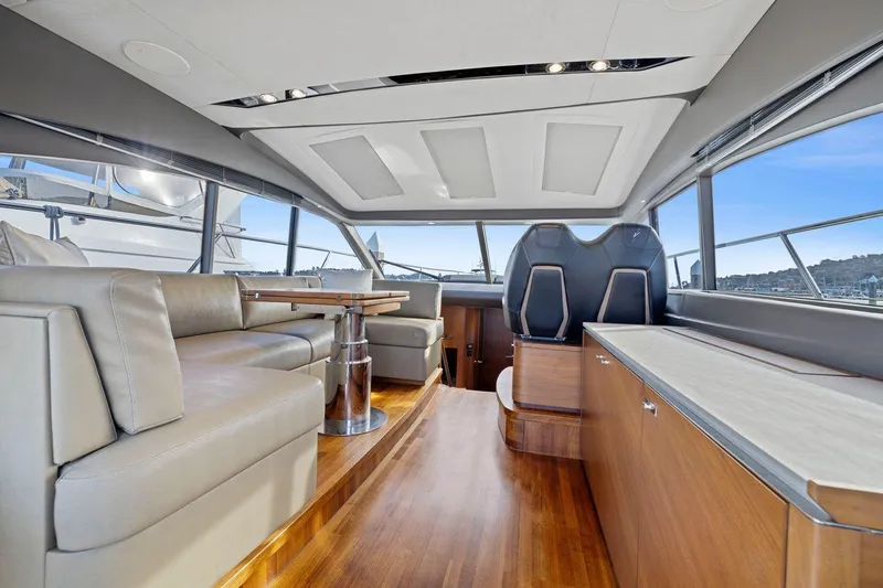 Slide: The Image of Luxurious interior of 2019 Princess V50 yacht with leather seating and wooden finishes. - 23