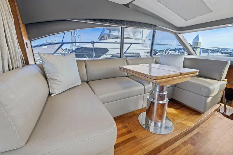 Slide: The Image of Luxurious interior of 2019 Princess V50 yacht with elegant seating and wooden table. - 25