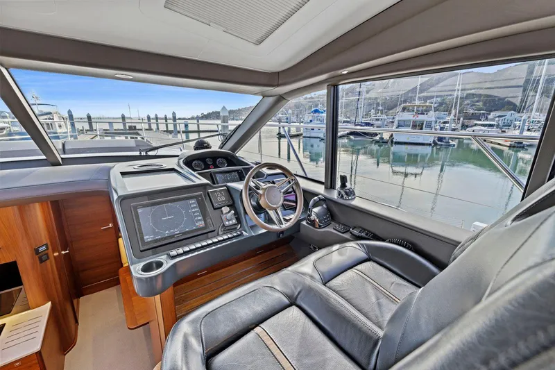 Slide: The Image of Luxurious 2019 Princess V50 yacht cockpit with marina view and modern navigation system. - 26
