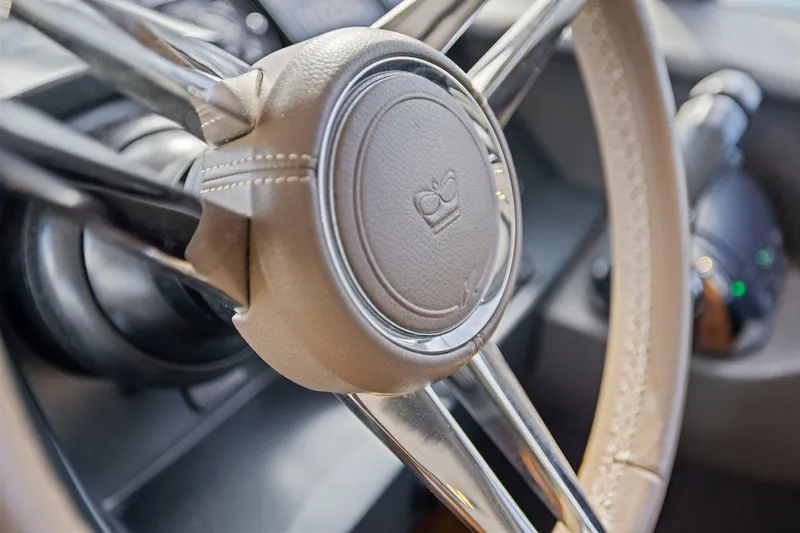 Slide: The Image of Close-up of 2019 Princess V50 steering wheel with leather and chrome details. - 28