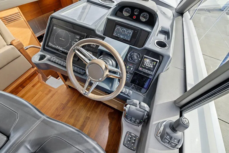 Slide: The Image of 2019 Princess V50 yacht helm with modern navigation controls and sleek design. - 29