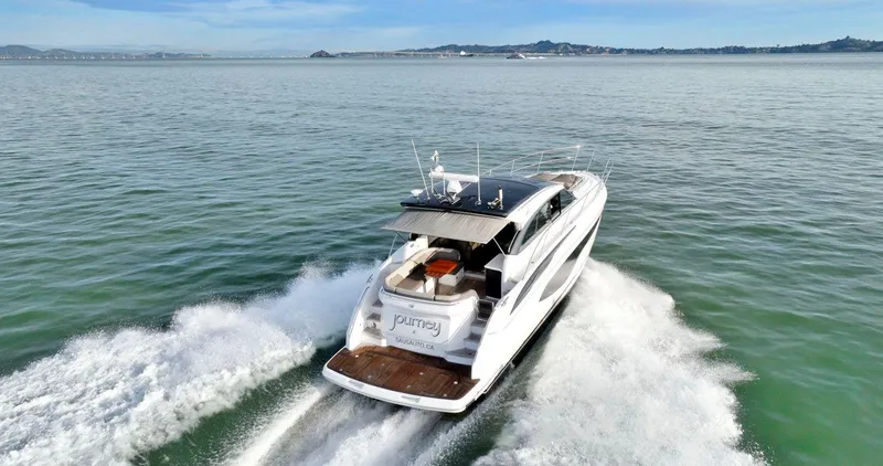 Slide: The Image of 2019 Princess V50 yacht cruising on open water, leaving a wake behind. - 3