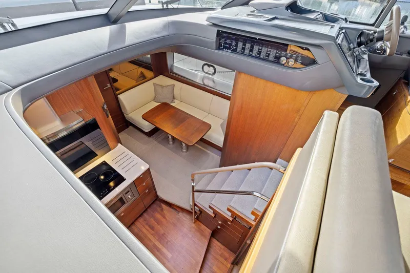 Slide: The Image of Luxurious interior of 2019 Princess V50 yacht with modern kitchen and seating area. - 32