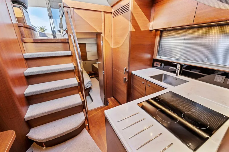 Slide: The Image of Luxurious 2019 Princess V50 yacht interior with modern kitchen and staircase. - 36
