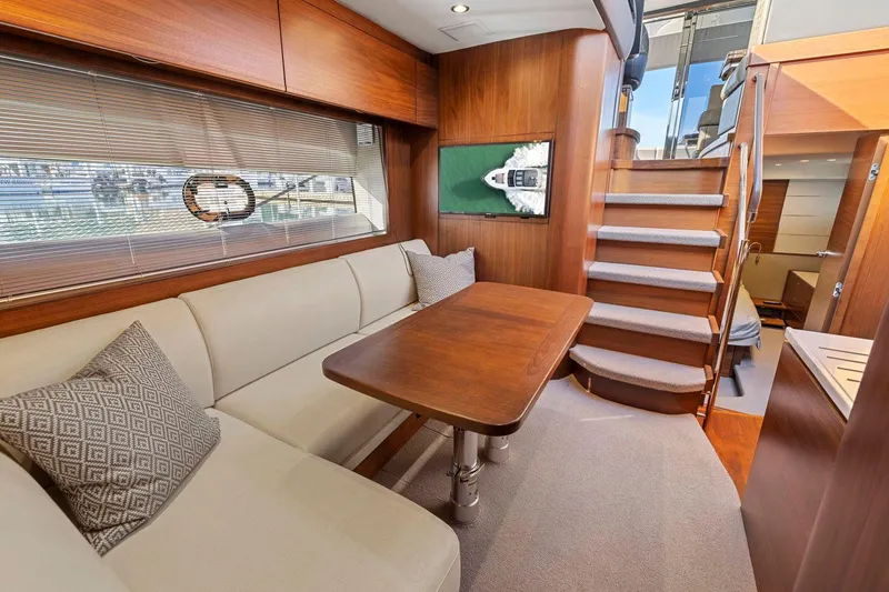 Slide: The Image of Luxurious interior of 2019 Princess V50 yacht with elegant seating and wooden finishes. - 37