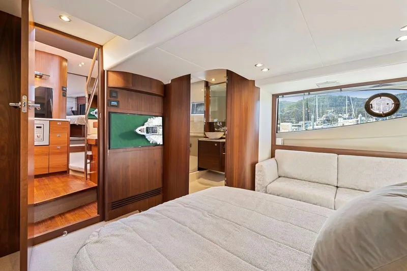 Slide: The Image of Luxurious interior of 2019 Princess V50 yacht with cozy seating and elegant wood finishes. - 41