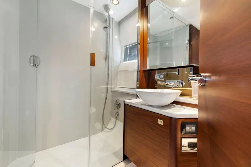 Slide: The Image of Luxurious 2019 Princess V50 yacht bathroom with modern fixtures and glass shower. - 42
