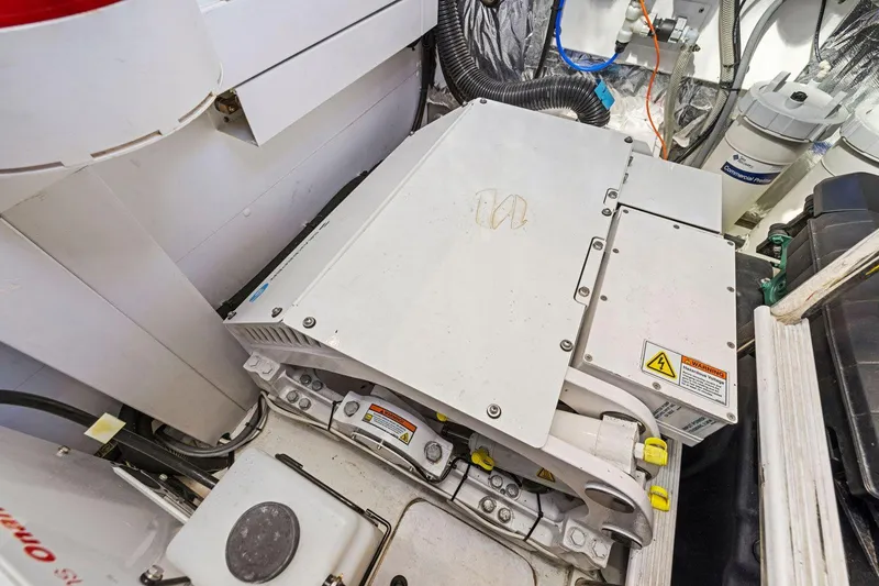 Slide: The Image of Engine room of 2019 Princess V50 yacht with mechanical components and wiring. - 48