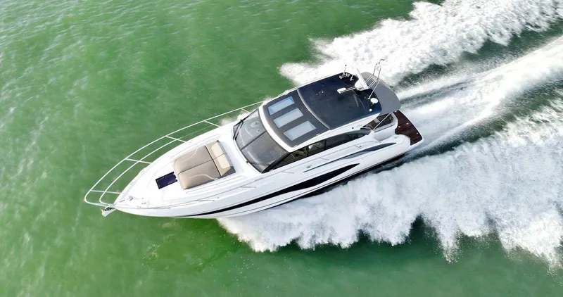 Slide: The Image of 2019 Princess V50 yacht cruising on green water, aerial view. - 6
