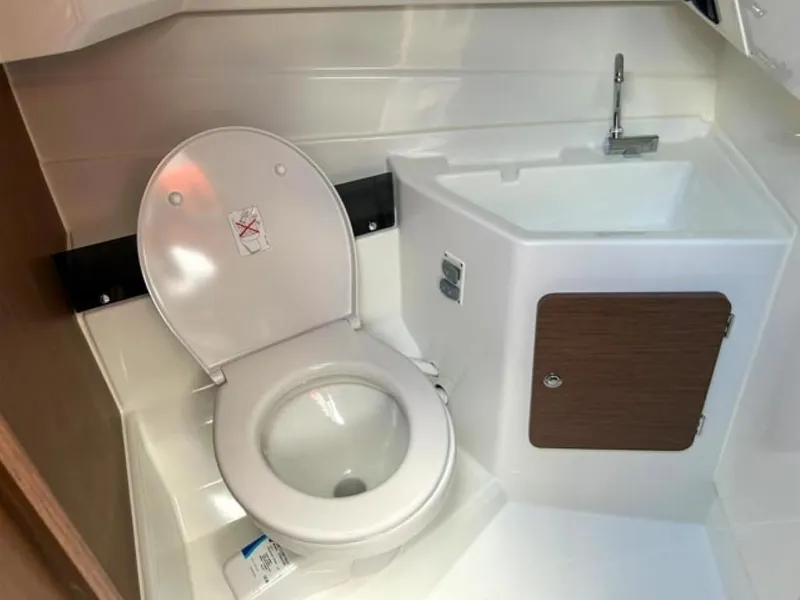 Slide: The Image of 2023 Beneteau Antares 8 bathroom with toilet and sink. - 9