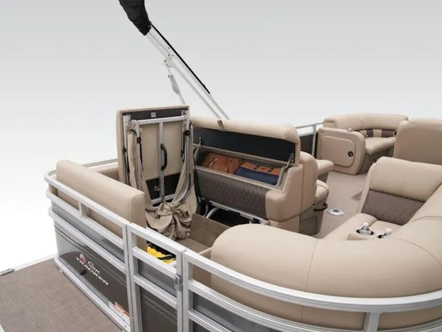 Slide: The Image of 2024 Sun Tracker PARTY BARGE® 22 RF XP3 interior with beige seating and storage compartments. - 5