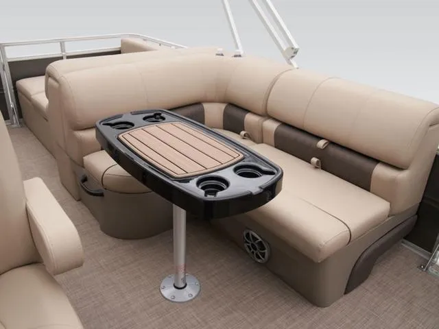 Slide: The Image of 2024 Sun Tracker PARTY BARGE® 22 RF XP3 interior with beige seating and table. - 6