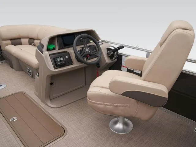 Slide: The Image of 2024 Sun Tracker PARTY BARGE® 22 RF XP3 interior with beige seating and steering console. - 9