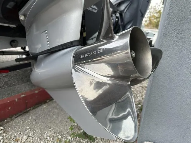 Slide: The Image of Close-up of 2024 Tracker PROTEAM 195 TXW boat propeller, showcasing shiny metal blades. - 13