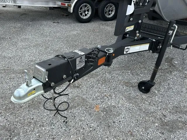 Slide: The Image of Trailer hitch of 2024 Tracker PROTEAM 195 TXW on gravel surface. - 3