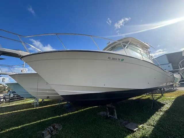 The Image of 2021 Grady-White Express 370 boat on display under clear blue sky. - 0