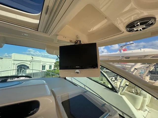 Slide: The Image of 2021 Grady-White Express 370 interior with mounted TV and speaker system. - 15