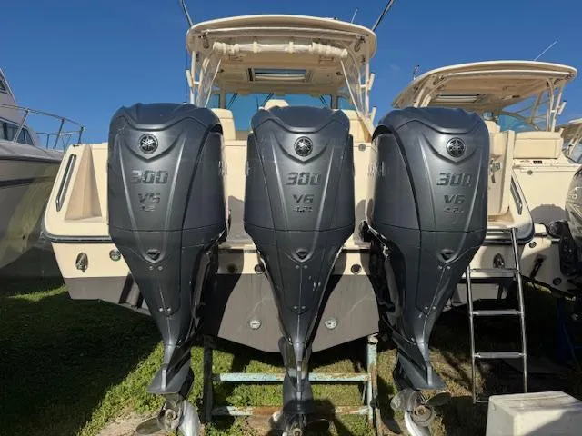 Slide: The Image of 2021 Grady-White Express 370 with triple 300 V6 outboard engines. - 2