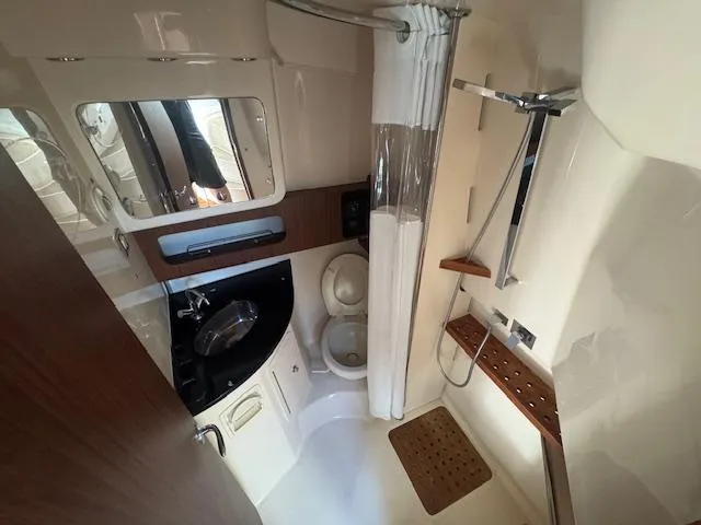 Slide: The Image of 2021 Grady-White Express 370 bathroom with shower, sink, and toilet. - 20