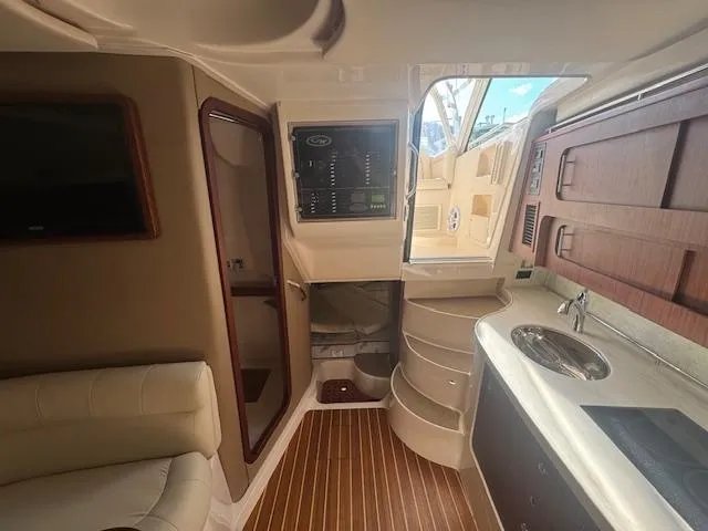 Slide: The Image of Interior of 2021 Grady-White Express 370 boat, featuring modern kitchen and seating area. - 25