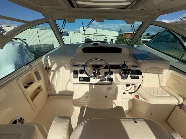 Slide: The Image of 2021 Grady-White Express 370 boat interior with modern helm and seating. - 8
