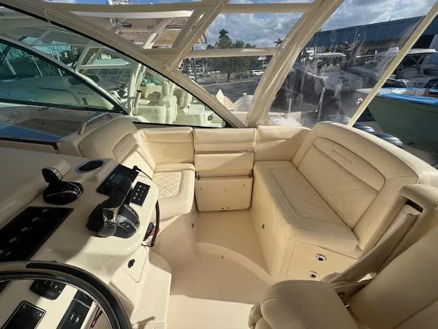 Slide: The Image of Luxurious 2021 Grady-White Express 370 boat interior with plush seating and modern controls. - 9