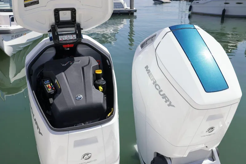 Slide: The Image of Mercury outboard engines on a 2022 Tiara Yachts 43 LE, docked at a marina. - 11